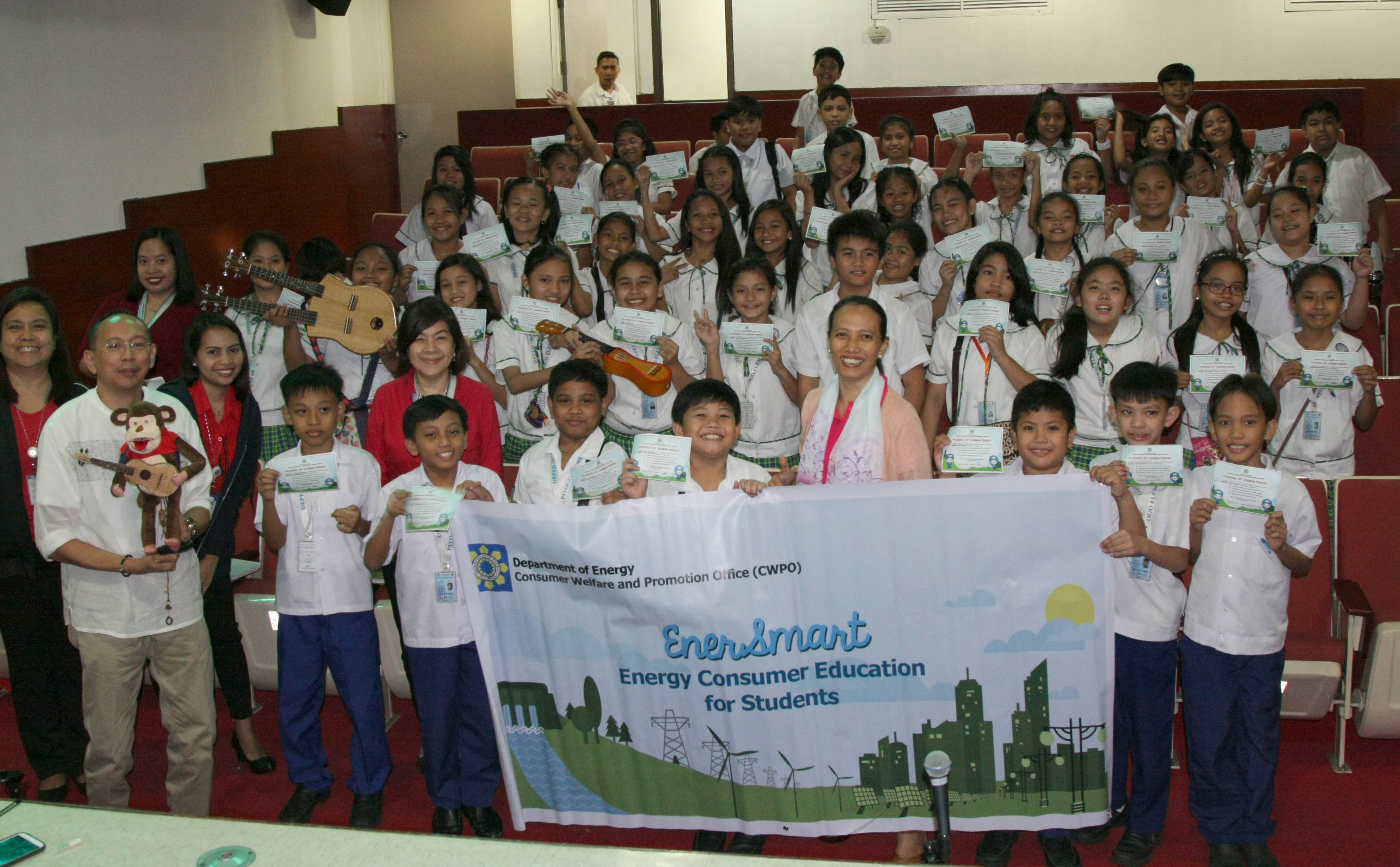 Student participants from Pitogo Elementary School together with their teacher and DOE-CWPO staff pose for a group photo after the information, education and communication activities.