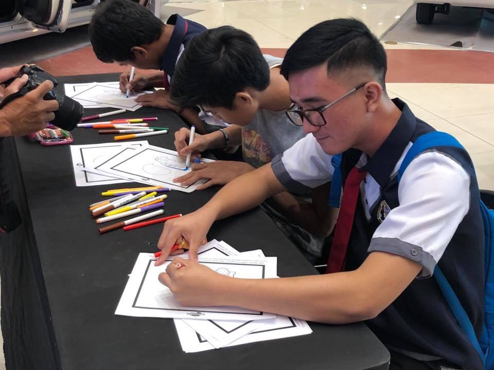 Visitors both young and old at the Interactive Energy Expo 2018 explore their creativity by coloring pages that illustrate the importance of energy in our lives. 