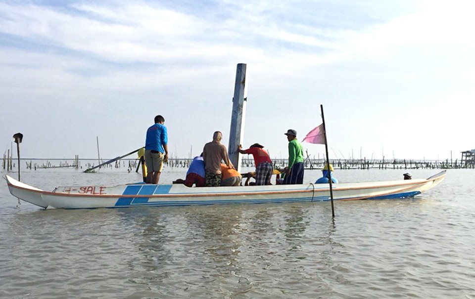 Responders from the energy family's Task Force Kapatid use wooden banca to transport replacement steel poles and fast-track restoration efforts in typhoon Ompong-hit areas despite the difficult terrain. 